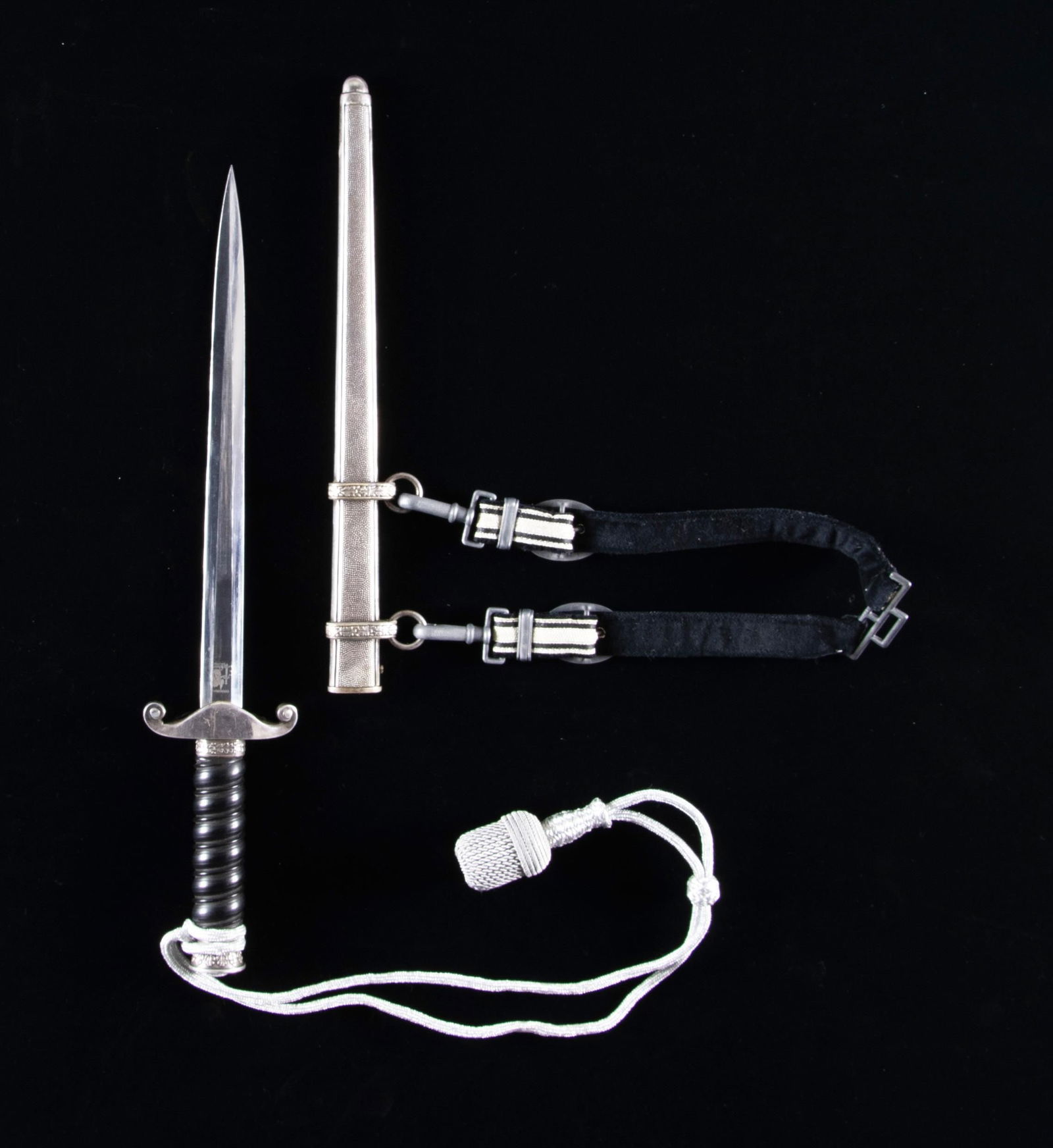 WWII GERMAN 1ST MODEL RAILWAY DAGGER & HANGER: A superb example of a WWII Greman 1st model Railway dagger with knot and its rare original hanger. Plain blade marked "ORIGINAL (squirrel) Eickhorn SOLINGEN". Black composite grip with silver plated e