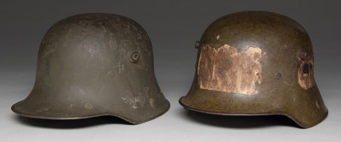 2 WWI GERMAN M17 STEEL HELMETS.