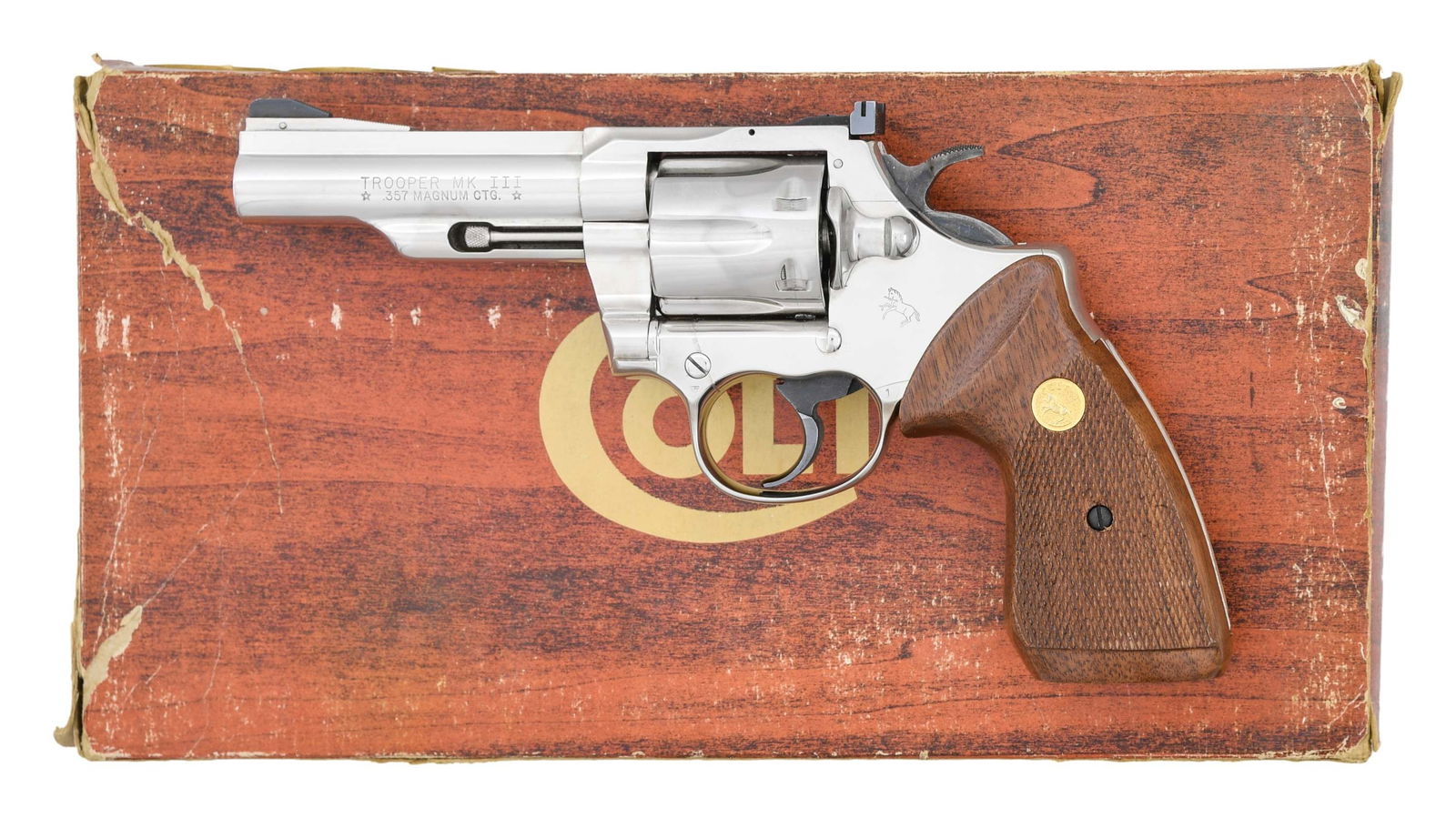 COLT 4" NICKELED .357 MAGNUM TROOPER MK III DA: REVOLVER. Cal. 357 Mag. S# 66862L. Bbl. 4" with blued ramped serrated blade front sight plus frame mounted Colt Accro adjustable rear sight. Mfg. 1980 (1969-1983) with uncommon nickel finish plus Colt