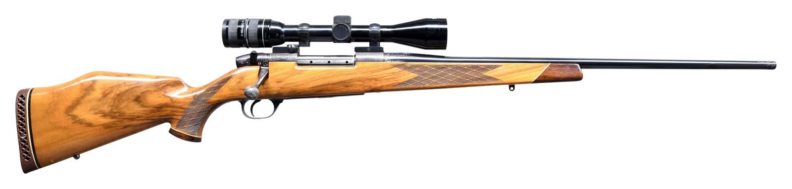 JOHN E. WARREN CUSTOM ENGRAVED WEATHERBY MK V: DELUXE BOLT ACTION RIFLE. Cal. 300 Wby Mag. S# 43418. Bbl. 24" tapered rnd. without sights. Weatherby 3-9X40mm gloss finished scope with heavy duplex reticle on 2-piece Redfield mounts. 9-locking lug
