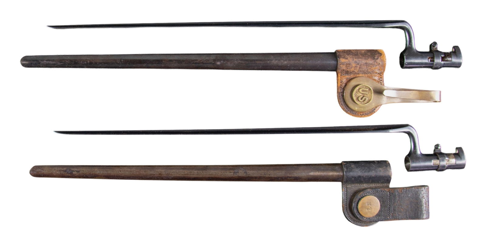 LOT OF 2 HIGH CONDITION SPRINGFIELD MODEL 1873: TRAPDOOR BAYONETS WITH SCABBARDS. Lot consists of 2 Springfield Model 1873 bayonets, including: 1) blued steel U.S. M1873 Trapdoor bayonet. Bayonet flat is stamped "US". UNATTACHED ACCESSORIES: blued