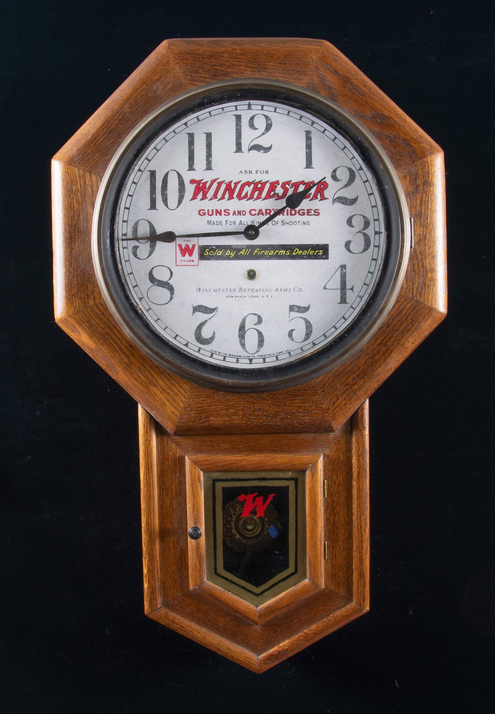 VERY ATTRACTIVE SESSIONS CLOCK CO. MODEL, CLINTON: WINCHESTER ADVERTISING REGULATOR WALL CLOCK. Clinton Regulator clock mfg. by the Sessions Clock Company in Forestville, Connecticut circa. 1920. The clock face is marked "ASK FOR" above the Winchester