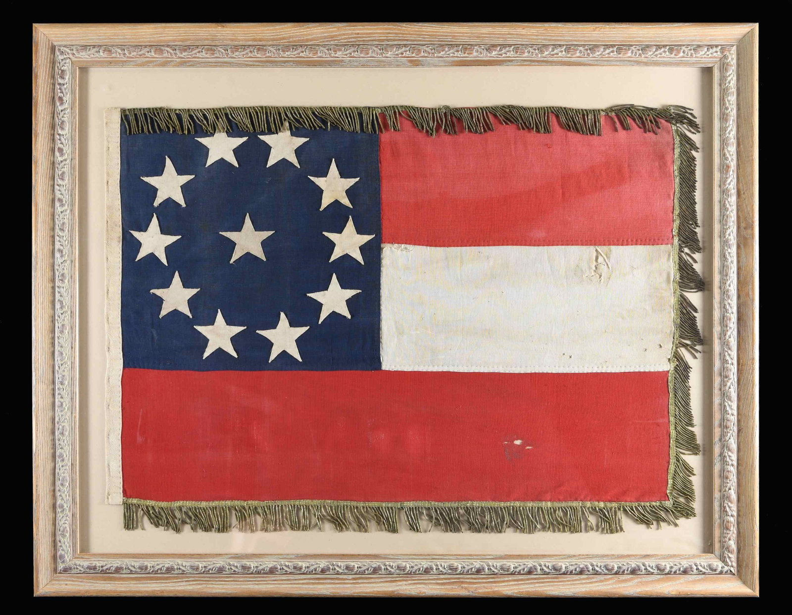 POST-CIVIL WAR CONFEDERATE 11-STAR FIRST NATIONAL: FLAG. This Confederate First National flag appears to have been manufactured in the first half of the 20th century, possibly for the UCV or the SCV. It is professionally framed in an antiqued wooden f
