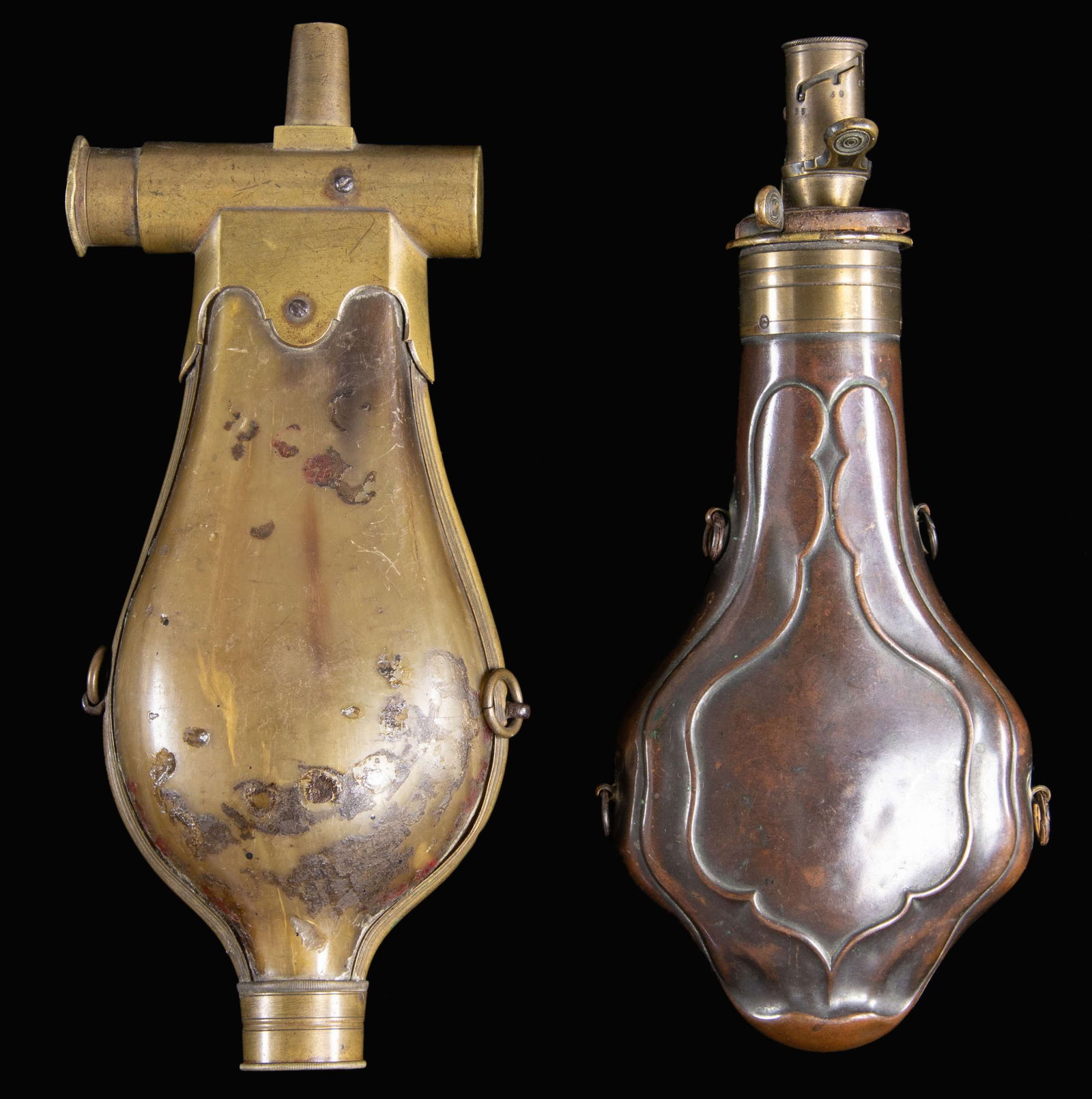 TWO RARE EARLY FRENCH POWDER FLASKS.: 9" brass bound horn stamped on charger "PARAU'n DE GROSSET INV'R / FARQUE / 1929"; 8.5" violin shaped embossed "BOCHE A PARIS" stamped patent charger. CONDITION: both sound, small denting in Boche. Ho
