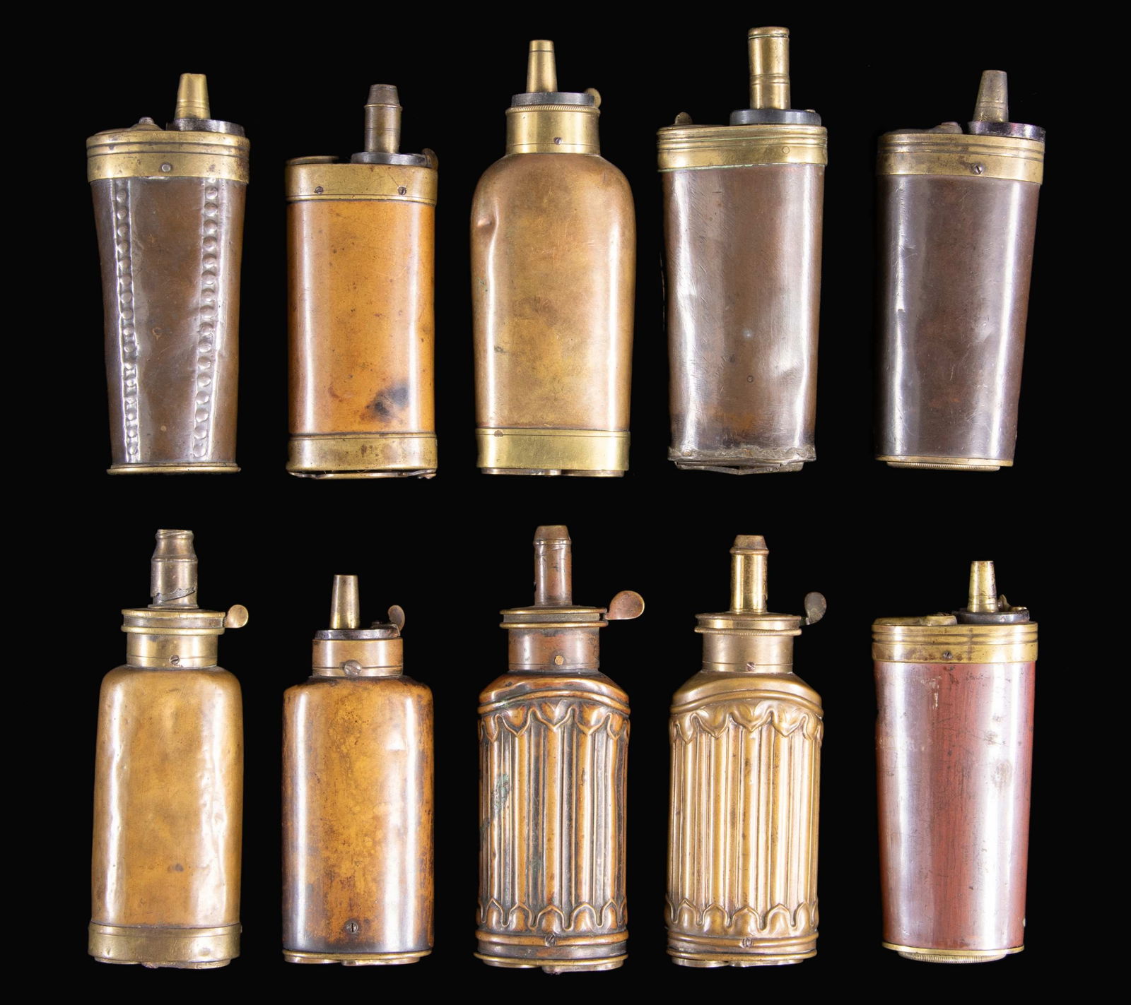 TEN MULTI-COMPARTMENT PISTOL FLASKS FOR POWDER,: CAP, & BALL. Ranging from 4.5" to 5". CONDITION: fair to very good overall. PROVENANCE: The Esteemed Norm Greenberg Collection. (02-24848-17/JS). NON-GUN. $2,000-4,000.