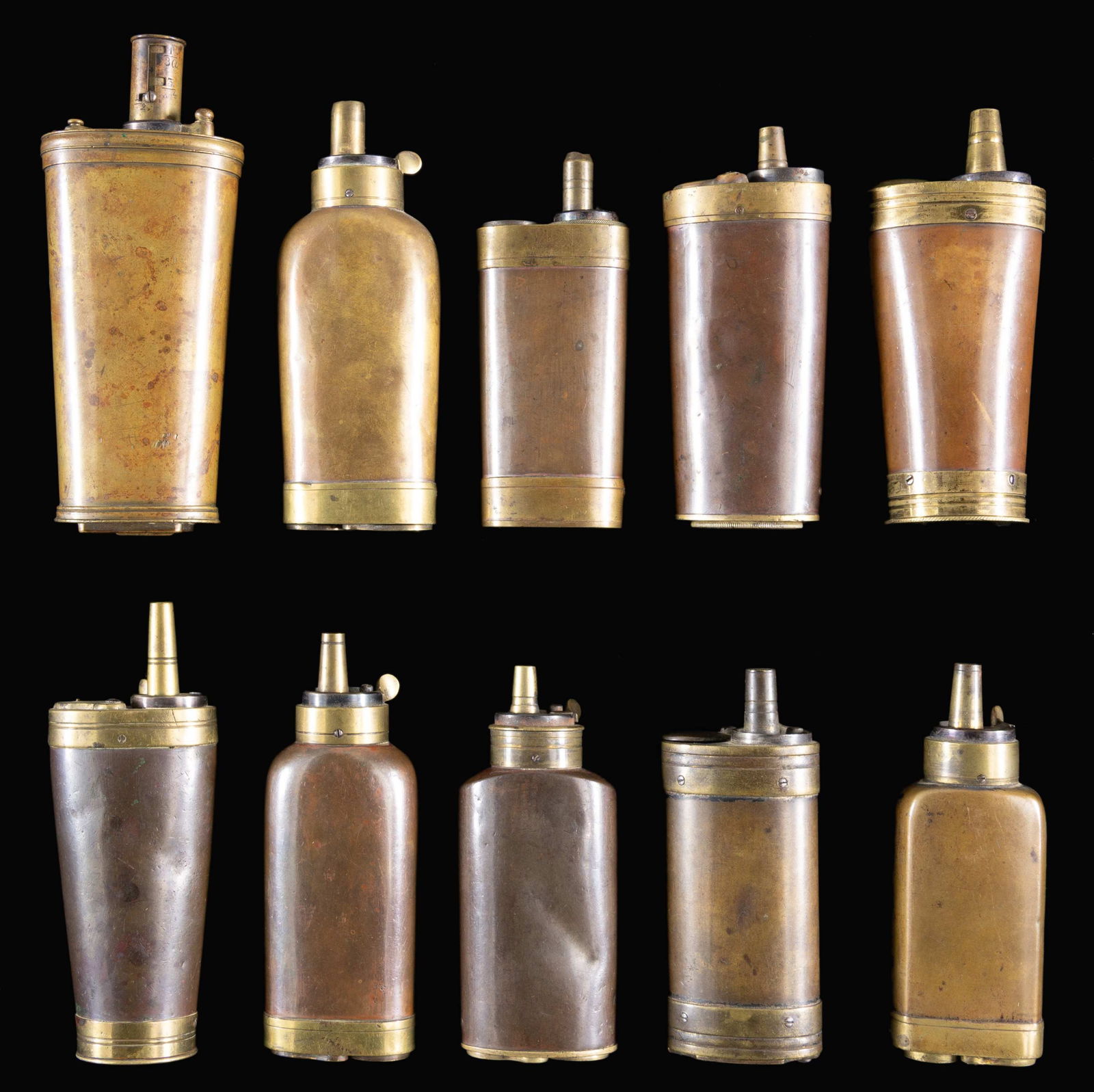 TEN MULTI-COMPARTMENT PISTOL FLASKS FOR POWDER,: CAP, & BALL. Ranging from 4" to 6". CONDITION: good to very good overall. PROVENANCE: Norman Greenberg estate collection. (02-24848-19/JS). NON-GUN. $2,000-4,000.