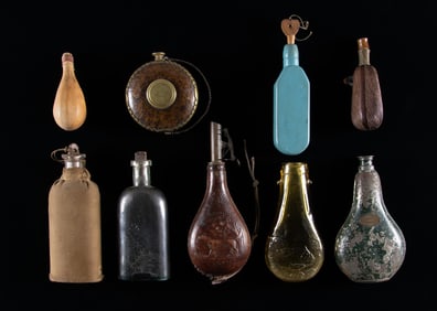 NINE POWDER & SHOT FLASKS.