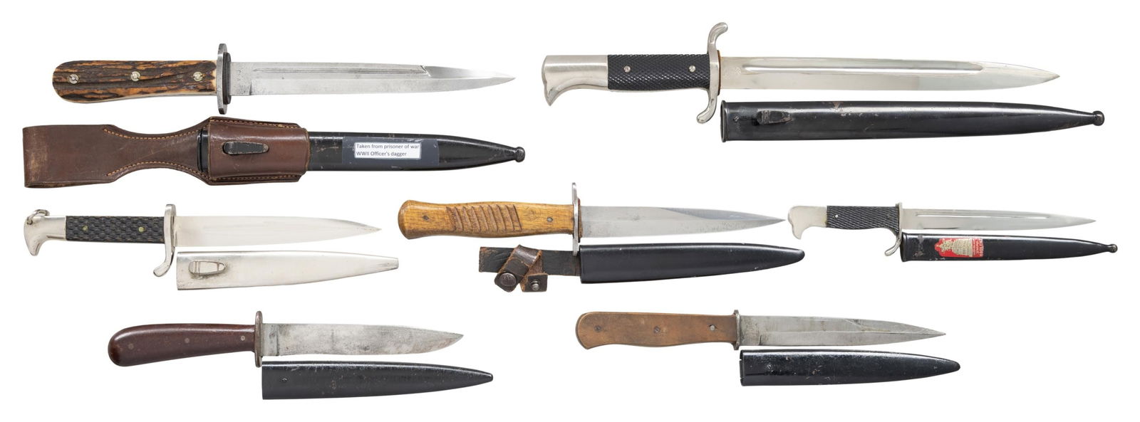 7 WWII GERMAN BAYONETS & BOOT OR FIGHTING KNIVES.: This lot of German edged weapons include 1 Boot knife measuring 11 1/4" overall with an unmarked blade, wooden grips and a black enameled scabbard. / 1 Boot knife measuring 10 3/4" overall with a blad