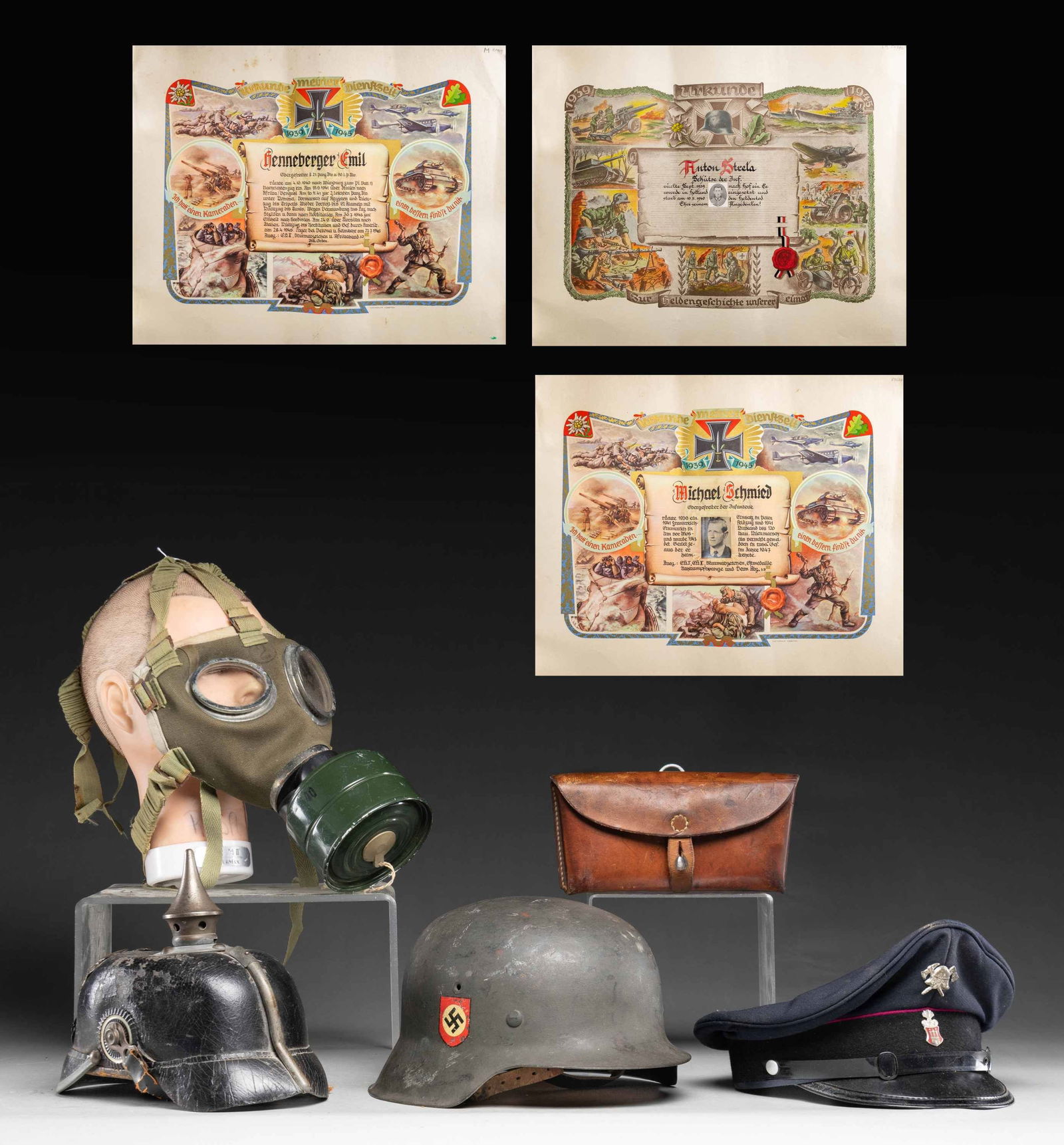 WWI & WWII GERMAN HEAD GEAR, GAS MASK, AND MORE.: This varied lot includes 1 WWI era fire service visor cap from Odenburg in the Austro-Hungarian empire. / 1 WWI Prussian enlisted man's gray metal trimmed spike helmet with correct kokarden. / 1 WWII