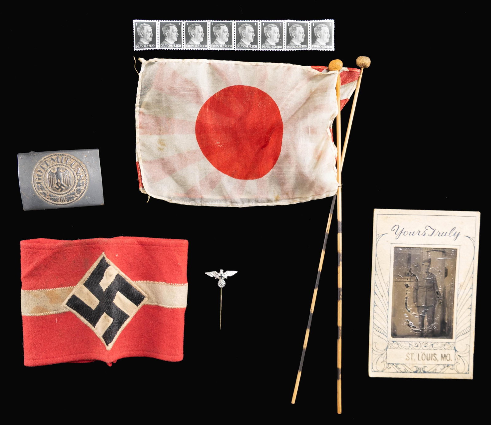 WWII GERMAN AND OTHER MILITARIA.: This varied lot includes 1 wool HJ armband of very small size. / 1 Veterans Association stick pin. / 1 Horizontal row of eight Hitler ein pfennig stamps. / 1 WWII German army belt buckle. / 1 Tin type