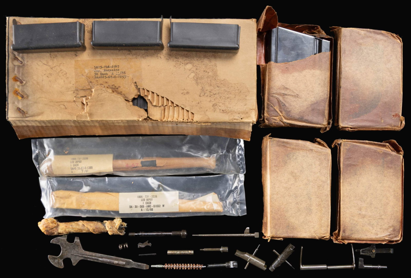 SMALL LOT OF BROWNING MODEL 1918 BAR PARTS & TOOLS: An assortment of Browning Model 1918 BAR small parts & accessories, including the following: 1 box of 50 +/- NOS magazine covers, 4 original NOS 20 rd. magazines, in original wrappers, 1 pair (2 pcs.)