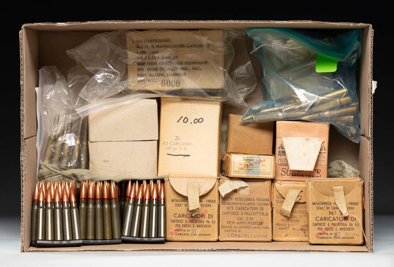 MIXED SURPLUS RIFLE AMMO LOT.: This lot consists of the following ammo: 1) 25rds. of varied 6.5 Jap FMJ ammo that appears to be Chinese made marked "D53". 5 rds are unmarked & on a stripper clip. Most ammo is in a box that is well