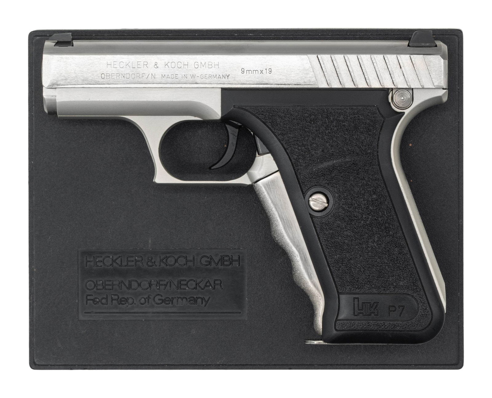 GERMAN POLICE MARKED HECKLER & KOCH P7: "SQUEEZE COCKER" SEMI-AUTOMATIC PISTOL WITH MATCHING FACTORY CASE. Cal. 9x19mm. S# 67646. Bbl. 4 1/8". P7 semi-automatic pistol mfg. in West Germany by Heckler & Koch in 1985. The left side of the