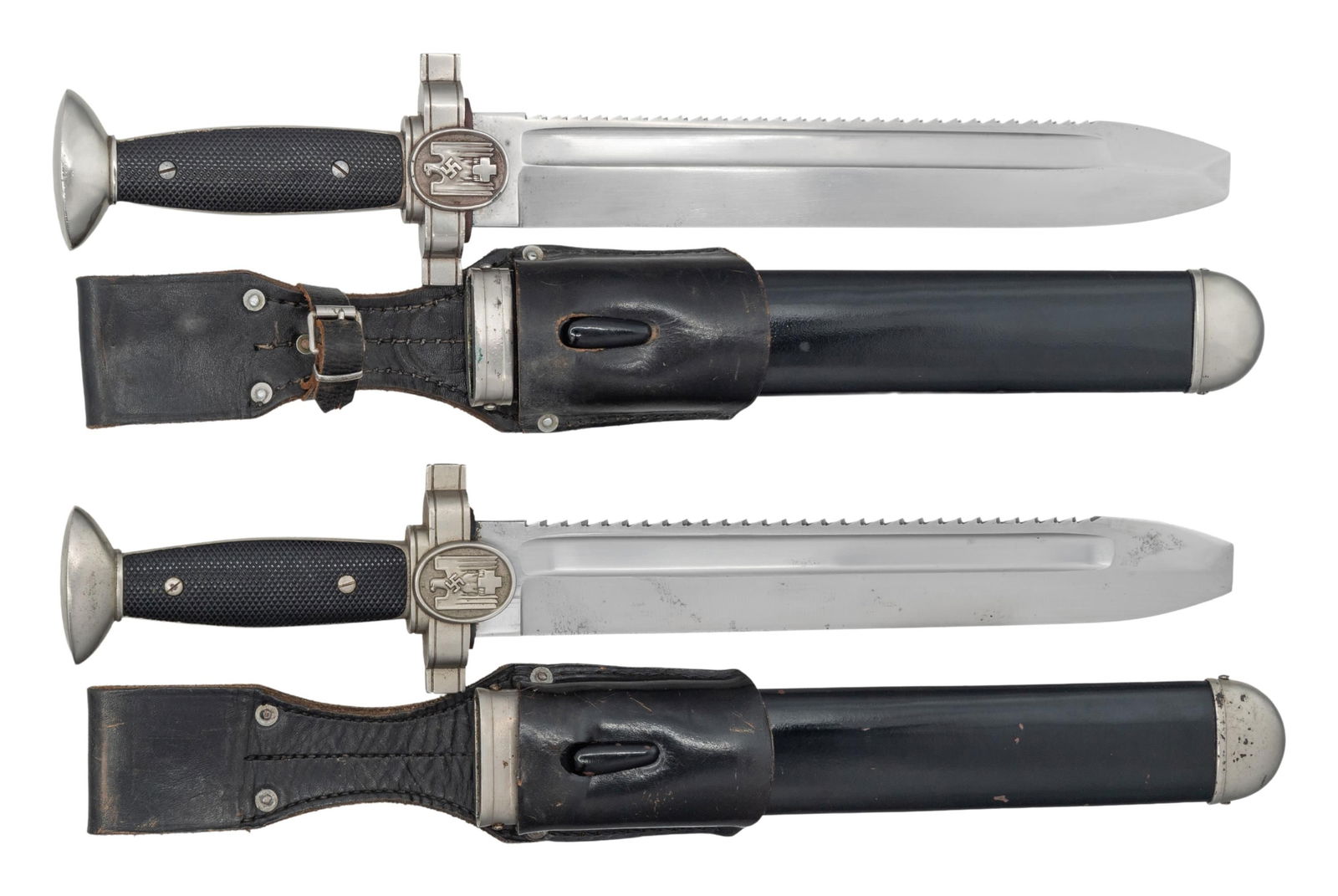 2 WWII GERMAN RED CROSS DAGGERS/HEWERS.: 1) This dagger measures 16 3/8" overall with a plain, sawback, blunted blade featuring a fuller near the spine. The ricasso on the reverse is marked "GES. GESCHUTZT." Plated crossguard featuring a