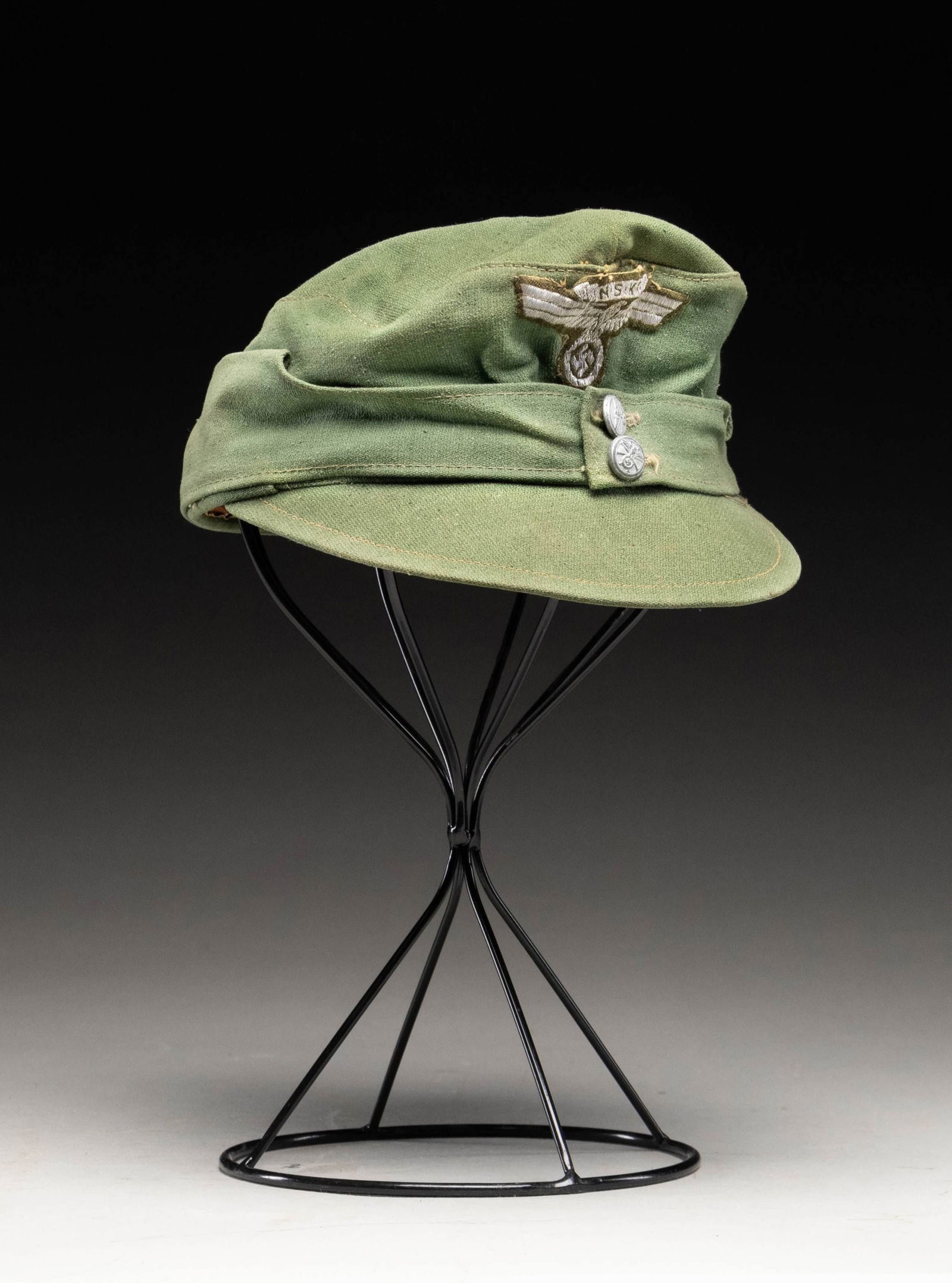 WWII GERMAN M43 STYLE CAP OF THE NSKK.: A nice example of a WWII German M1943 style cap for the NSKK in dull sage green with a brownish green flat bullion NSKK eagle and banner on the front. There are 2 small NSKK buttons on the front that