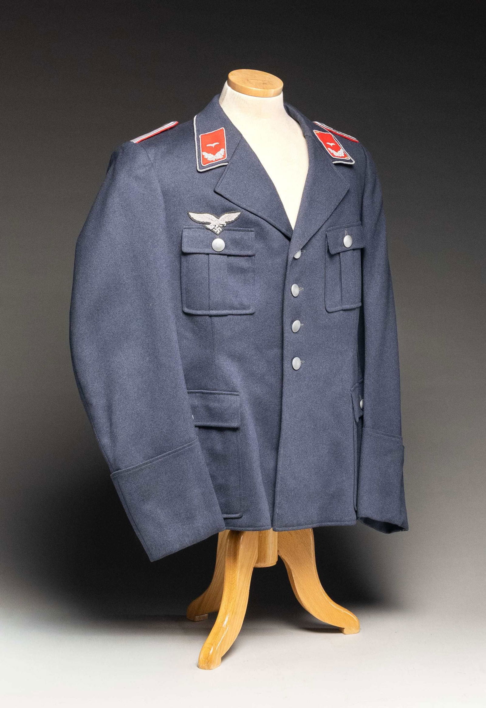 WWII GERMAN LUFTWAFFE FLAK LIEUTENANT'S TUNIC.: A deep blue/gray tunic with a bullion piped collar and bullion piped red and bullion collar tabs with 1 gull for a flak Lieutenant. The shoulder straps are straight bullion with a red backing. There a