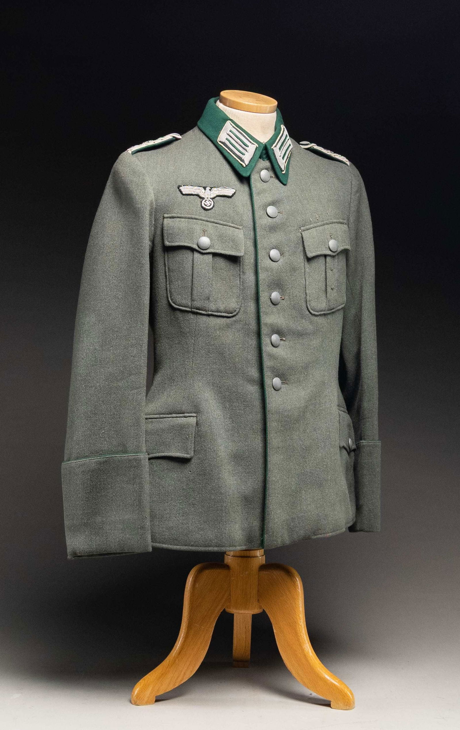 WWII GERMAN WEHRMACHT MAJOR'S TUNIC.: A deep sage green tunic with a bright green collar for a Major of the Wehrmacht. Collar tabs are silver bullion with green centers on a black field, piped in white. The shoulder boards are silver bull