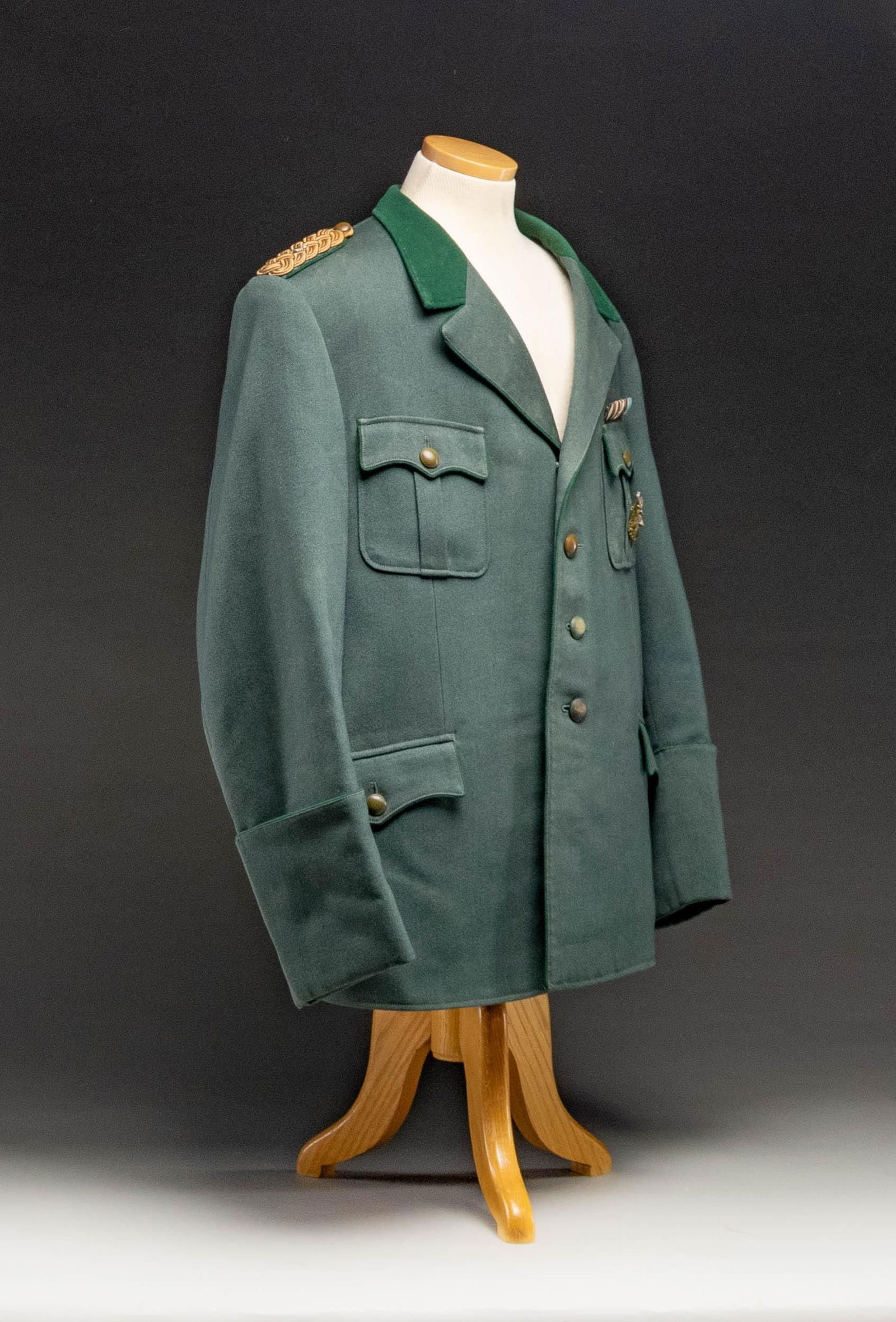 RARE WWII GERMAN NATIONAL HUNTING MASTER TUNIC.: A seldom seen German WWII for a National Hunting Master tunic in deep sage green with a bright green collar and piping. The shoulder boards are comperable to a generals being knotted gold bullion with
