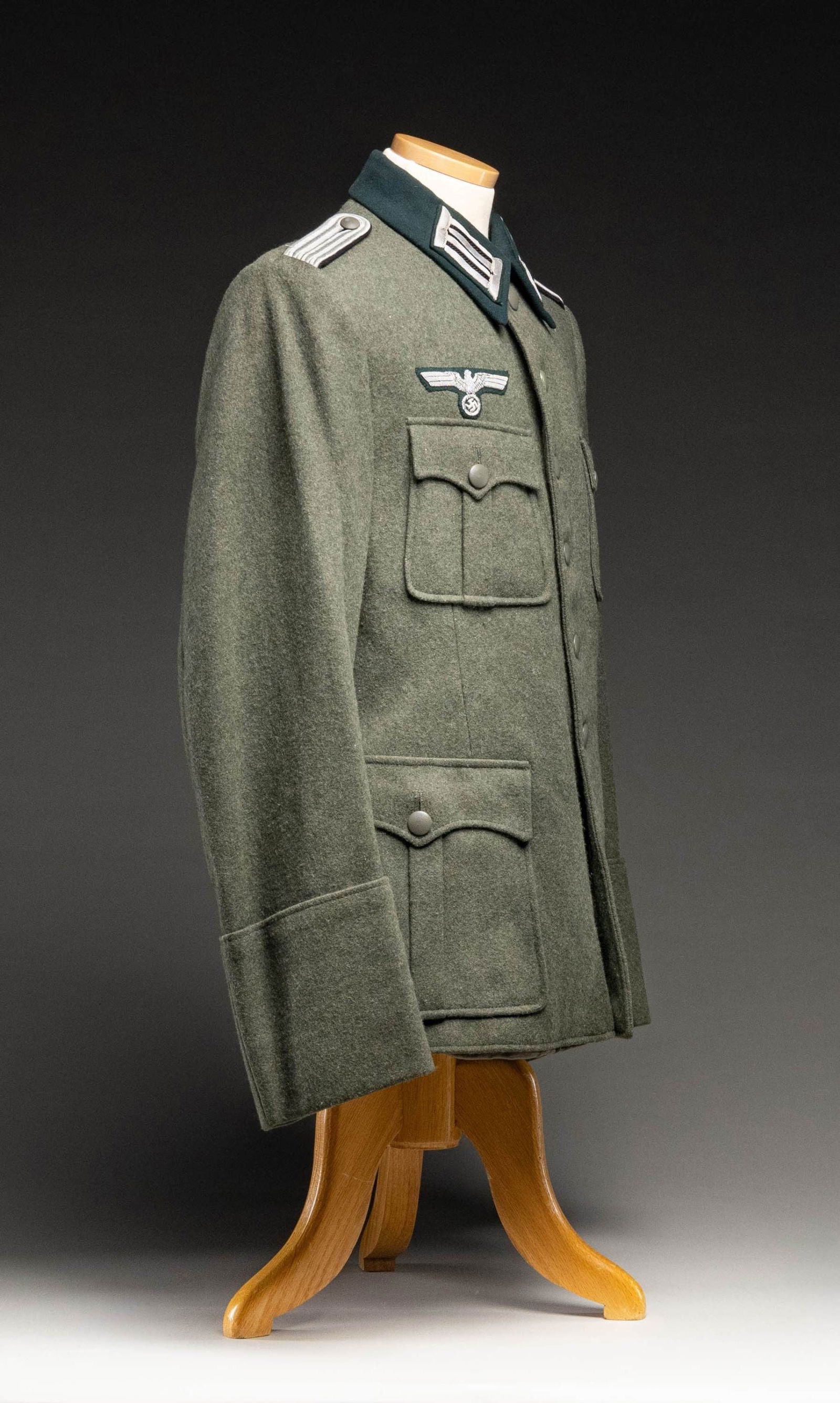 WWII GERMAN PIONEER LIEUTENANT'S UNIFORM COAT.: A very good example of a sage green heavy wool uniform coat with a dark green collar for a WWII German Pioneer Lieutenant. The collar tabs are green and silver bullion with black centers. The shoulder