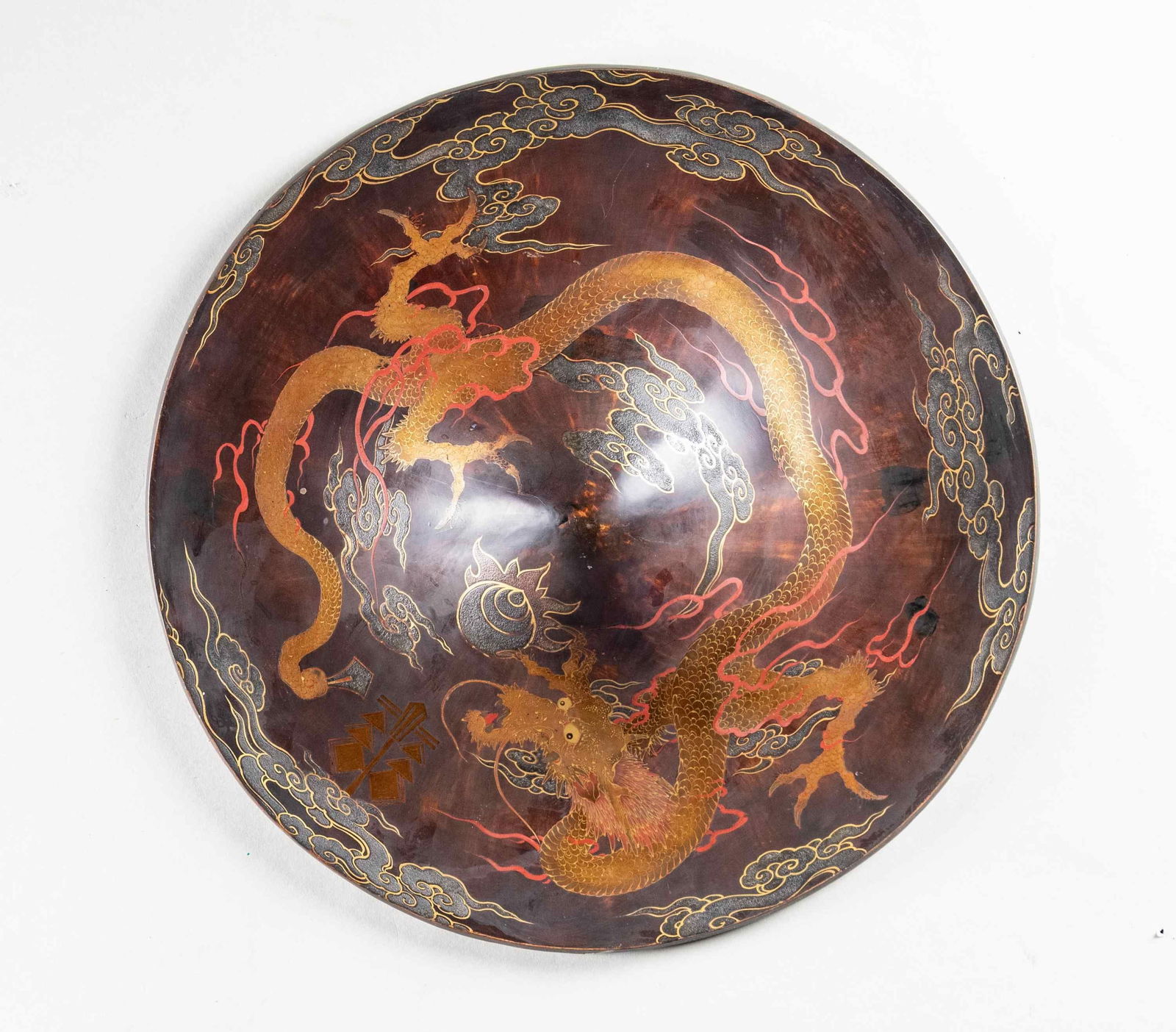 FINE LACQUERED EDO TO MEIJI PERIOD JAPANESE: SAMURAI JINGASA. This exceptionally artistically decorated enameled wood jingasa measures about 16 1/2" in diameter with a domed center. The top is decorated with an incredibly detailed dragon