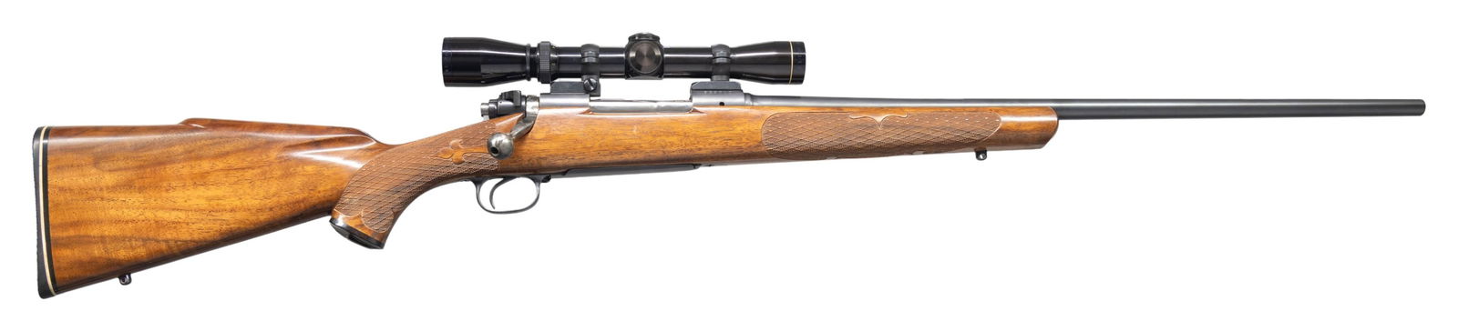 LEONARD MEWS CUSTOM WINCHESTER PRE-64 MODEL 70: BOLT-ACTION RIFLE. Cal. 264 Win Mag. S# 539010. Bbl. shortened to 21 3/4" without sights. Leopold Vari-XII 2-7X gloss finished scope w/ duplex reticle on Redfield two-piece mounts. Action features