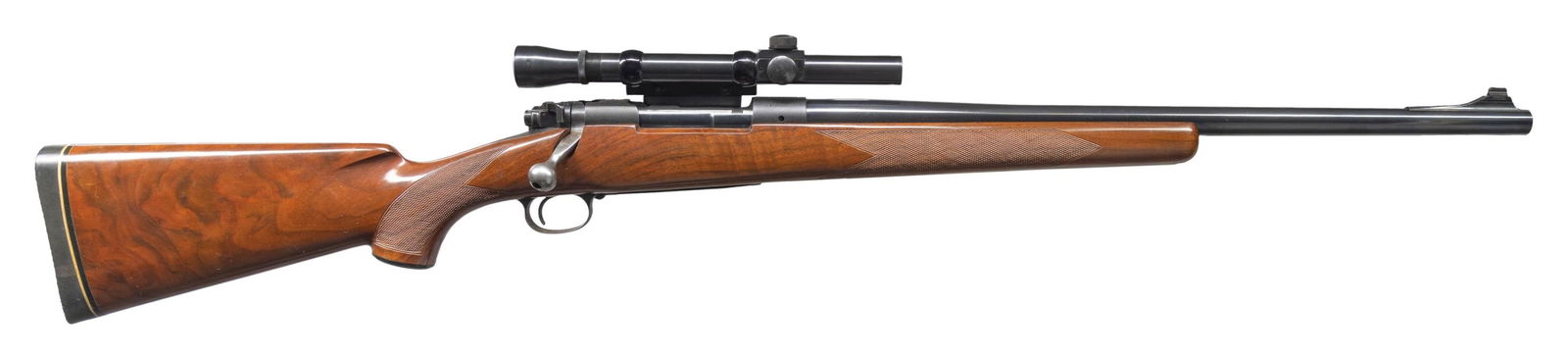 WINCHESTER MODEL 70 CUSTOM BOLT ACTION RIFLE.: Cal. 450 Watts Magnum. S# 318036. 22" custom heavy bbl. Ramp mounted blade front sight. Lyman All Weather 7/8" tube 2 1/2 power gloss finish scope with post reticle. Scope is mounted on a Griffin & Ho