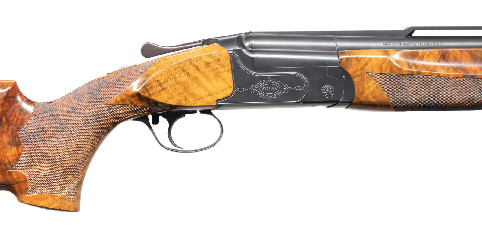 KOLAR ARMS THREE BARREL TRAP SET O/U SHOTGUN.: Cal. 12 ga. 2 3/4". S# K00274. Bbls. Set 1: 32" over under, open side rib and Kolar interchangeable chokes. White target front sight with white mid bead. Numbered to the gun with standard blue finish.