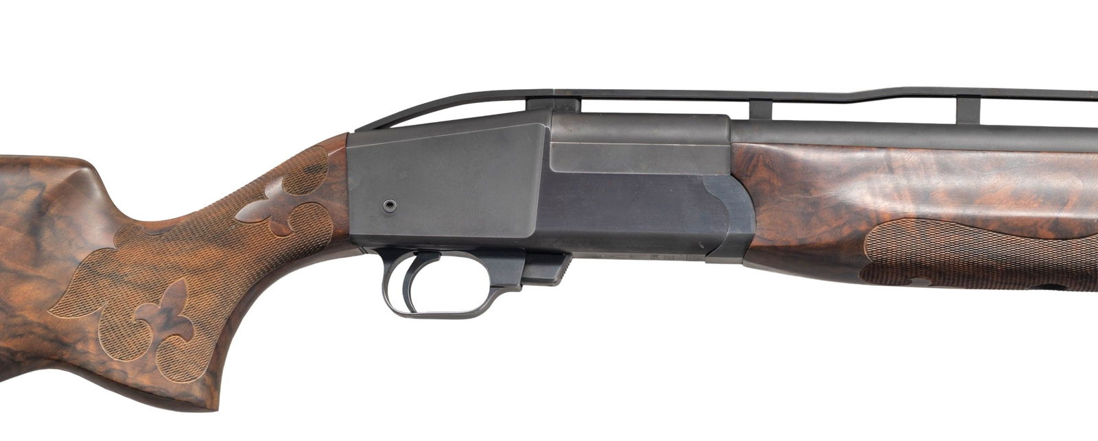 LJUTIC "MONO GUN" SINGLE BARREL TRAP GUN WITH CASE: Cal. 12 Ga. 2-3/4". S# 3099. The 34-1/2" barrel with choke tube is fitted with high raised matted ventilated rib holding two white beads. Monobloc is stamped "22" (assembly number ?) on bottom. Blued