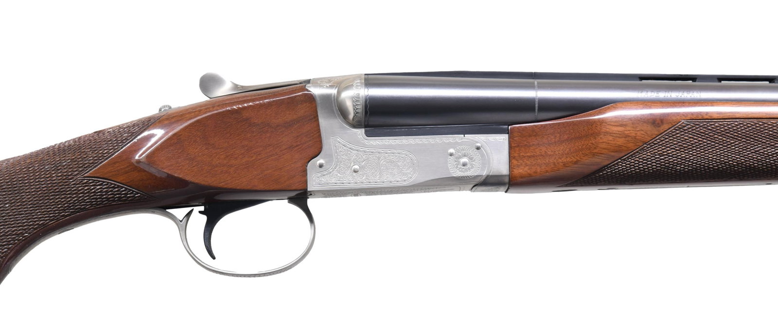 WINCHESTER MODEL 23 PIGEON GRADE SXS SHOTGUN.: Cal. 20 ga. 2 3/4". S# PWK201384. Bbl. 28" vent rib w/ white target front sight & mid bead. Fixed Mod & Full chokes. Satin silver finished boxlock action has generous coverage of scroll ornamentation