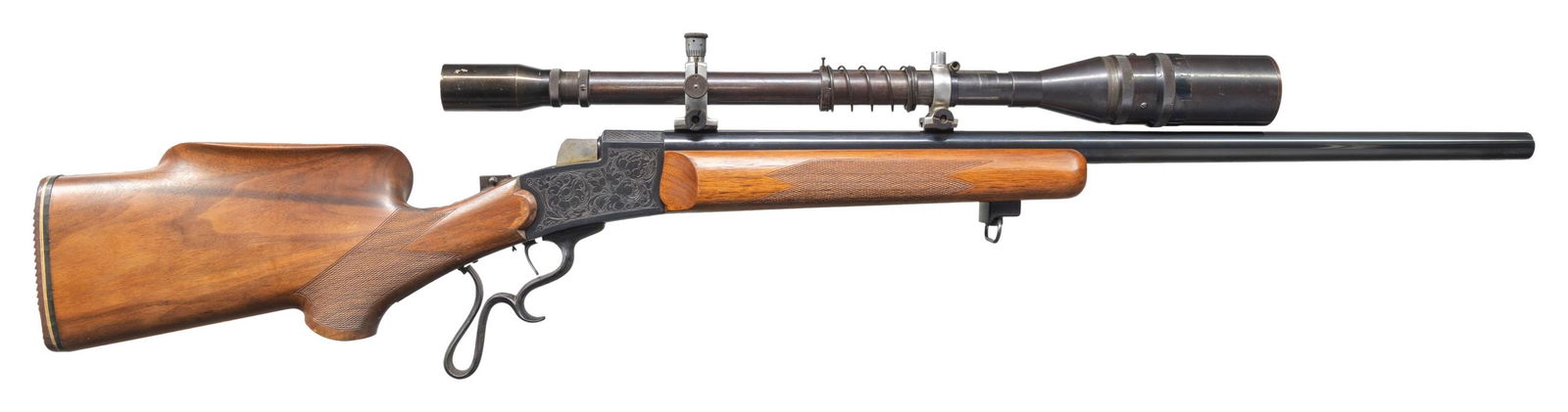 CUSTOM TARGET RIFLE ON GERMANIC STYLE FALLING: BLOCK ACTION. Cal. 22LR. NSN. Bbl 28 1/8" replacement heavy weight measuring 7/8" at muzzle. Left side of bbl is marked with builder's name "C.W. Olson". Receiver and ornate finger curl trigger guard