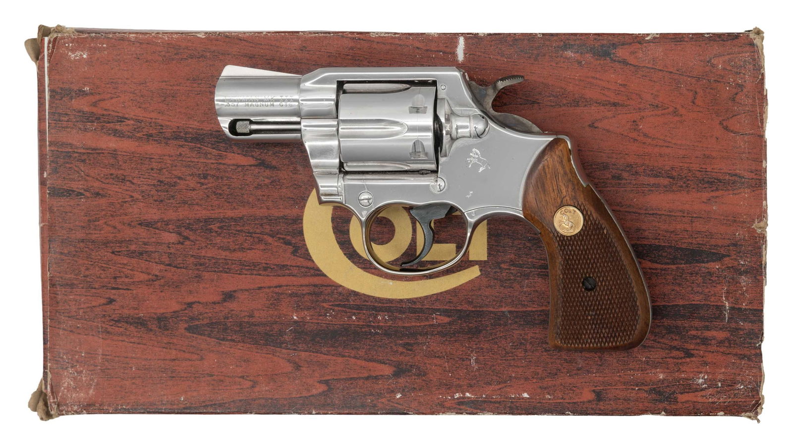 NICE NICKEL PLATED COLT LAWMAN MK III DOUBLE: ACTION REVOLVER WITH FACTORY BOX. Cal. 357 Magnum. S# L78974. Bbl. 2 1/8". Lawman Mk III double action revolver mfg. by Colt in 1978. Left side of the bbl. is marked "LAWMAN MK III/ .357 MAGNUM CTG",