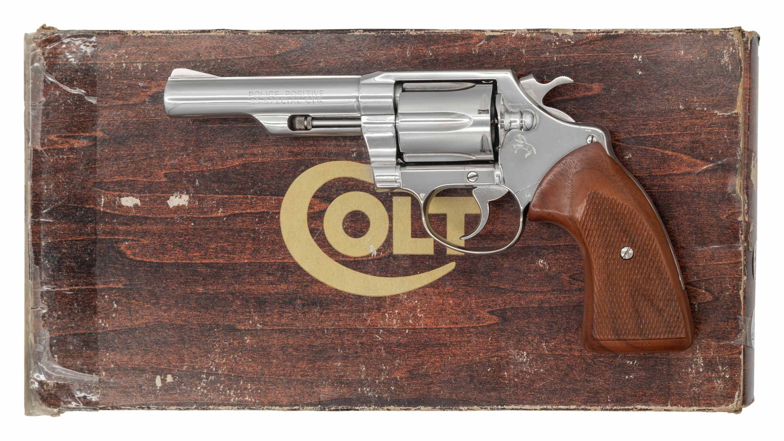 FINE NICKEL PLATED COLT POLICE POSITIVE DOUBLE: ACTION REVOLVER WITH MATCHING FACTORY BOX. Cal. 38 Spl. S# 19963R. Bbl. 4 1/8". Police Positive double action revolver mfg. by Colt. Left side of the bbl. is marked with the model and cal.