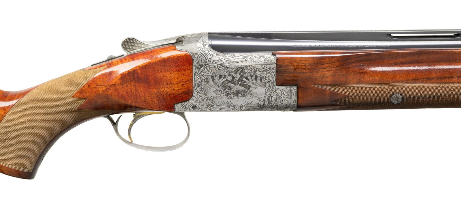 BROWNING DIANA GRADE SUPERPOSED BROADWAY TRAP O/U: SHOTGUN. Cal. 12 ga. 2 3/4". S#. 49956S6. Bbls. 32" with Broadway 5/8" wide vent rib. White front & mid beads. The bbls are aftermarket ported and fitted with Briley interchangeable chokes. A total