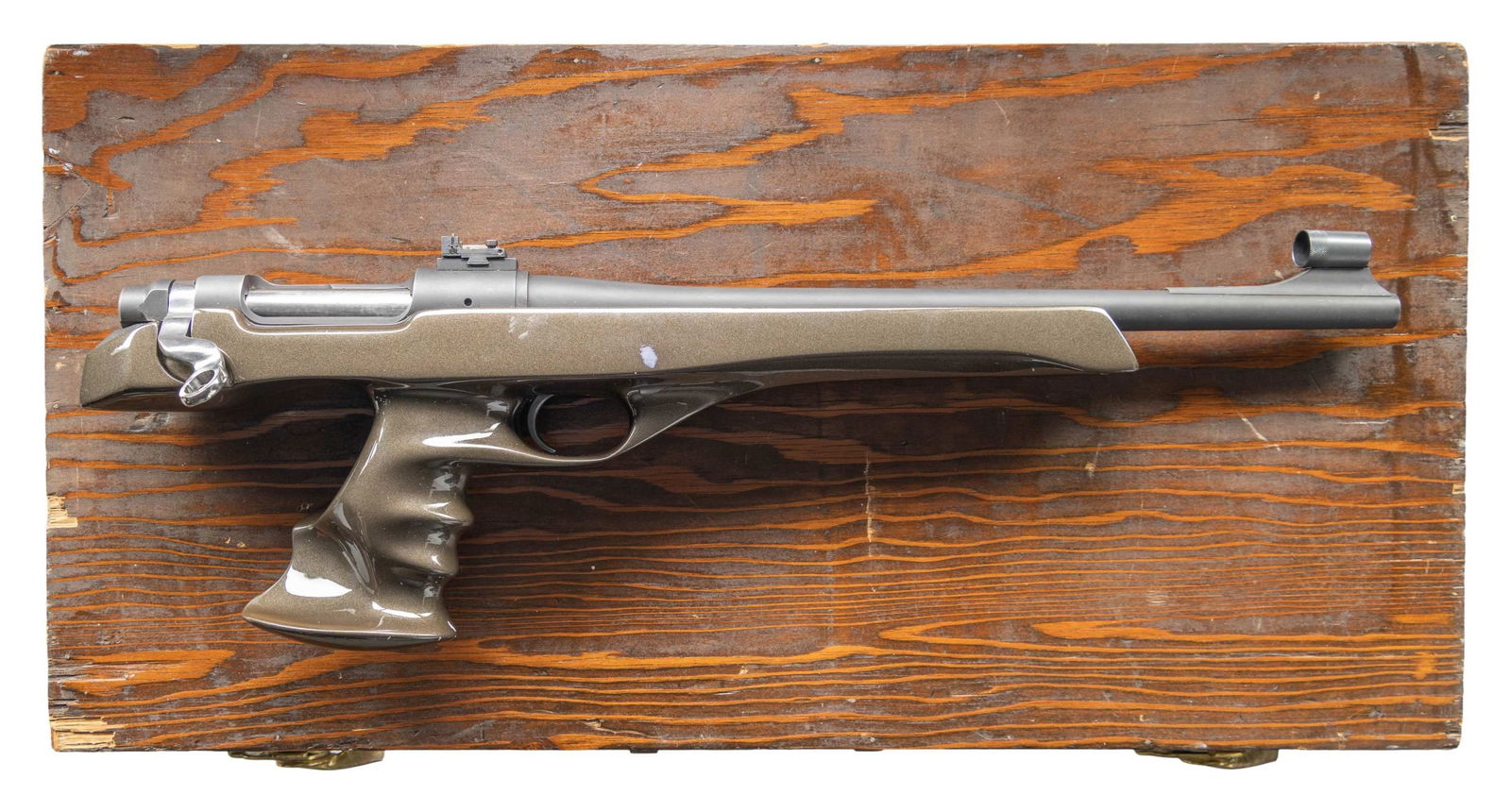 CUSTOM REMINGTON XP-100 BOLT ACTION PISTOL: Cal. 7x47 (7mmx47 Helm). S# B7504392. Consignor originally built this pistol in 1977. Bbl. 15". Hooded blade front sight & receiver mounted Micro rear sight. Bolt has been polished with skeletonized b