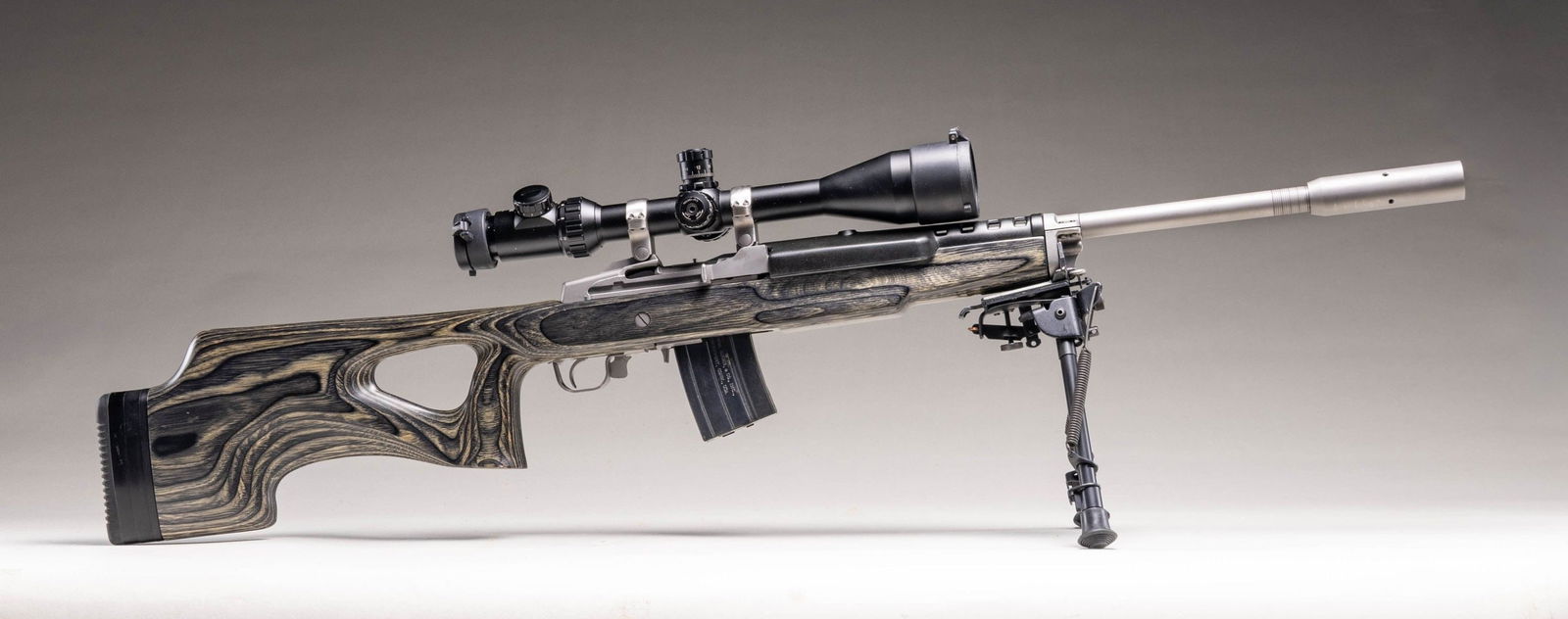 RUGER SCOPED STAINLESS MINI-14 TARGET SEMI-AUTO: RIFLE & ACCESSORIES. Cal. .223 Rem. S# 580-59803. Bbl. 22 heavy with target crown, harmonic dampener plus 1 in 9" RH twist; no provision for sights. Mfg. 2008 (1982 to date for all Ranch Rifles) as st