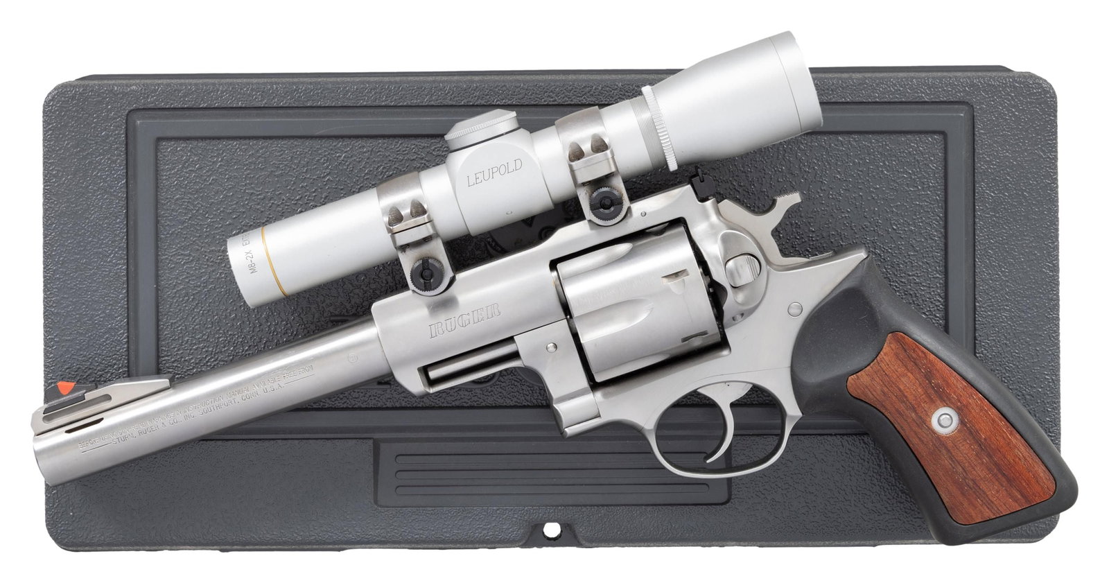 44 MAG. RUGER SUPER REDHAWK REVOLVER WITH LEUPOLD: SCOPE. Cal. 44 Mag. S# 551-24954. Shipped 1997 as Model 05501; Catalog No. KSRH-7. Ported 7.5" bbl. Orange insert ramp front sight & adj. rear sight. Leupold silver M8-2x EER duplex scope on stainless