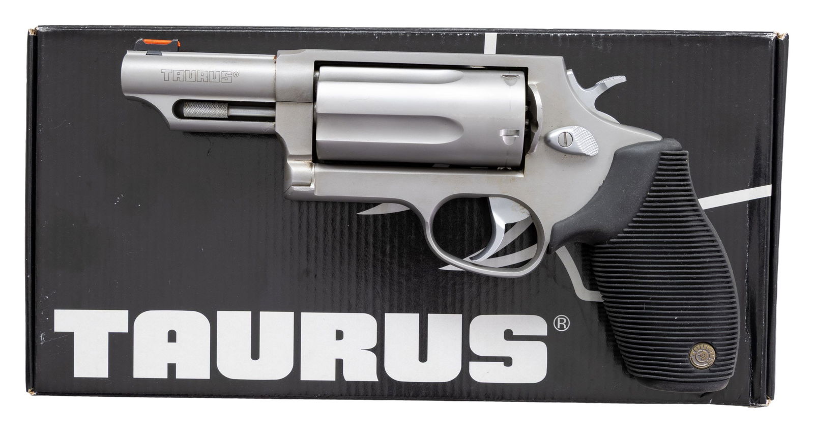 TAURUS JUDGE DA REVOLVER.: Cal. 410 3"/45 Colt. S# DR209905. Bbl. 3". Fiber optic front sight. Fixed rear sight. 5-shot cyl. Stainless finish. Grooved black rubber grips with Taurus medallions. UNATTACHED ACCESSORIES: matching