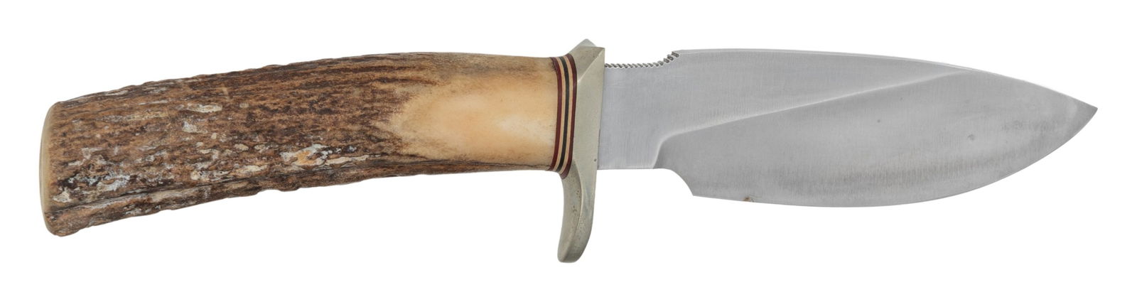 RANDALL MODEL 11 ALASKAN SKINNER KNIFE.: 9" overall length with 4 1/2" blade marked "RANDALL MADE/ORLANDO, FL S". 1" serrated section on top of blade. Silver plated hilt. Stag handle. No scabbard or stone present. CONDITION: grips show a 1