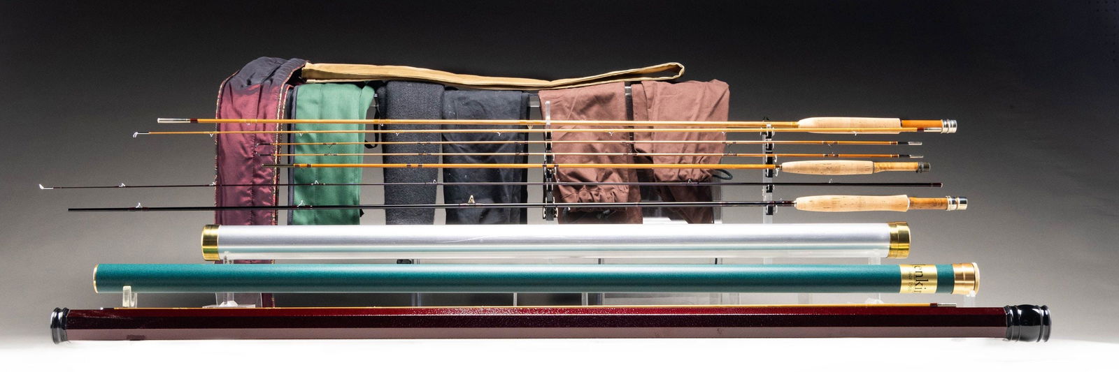 3 TROUT FLY RODS.: 1) Tom Morgan graphite fly rod. 8-1/2', 4 weight, 2 piece, 1 tip, agate stripper guide, burl wood reel seat, German silver hardware, marked "Berrien Moore III 8 1/2' No 4" "95-4-21", in bag with tube.