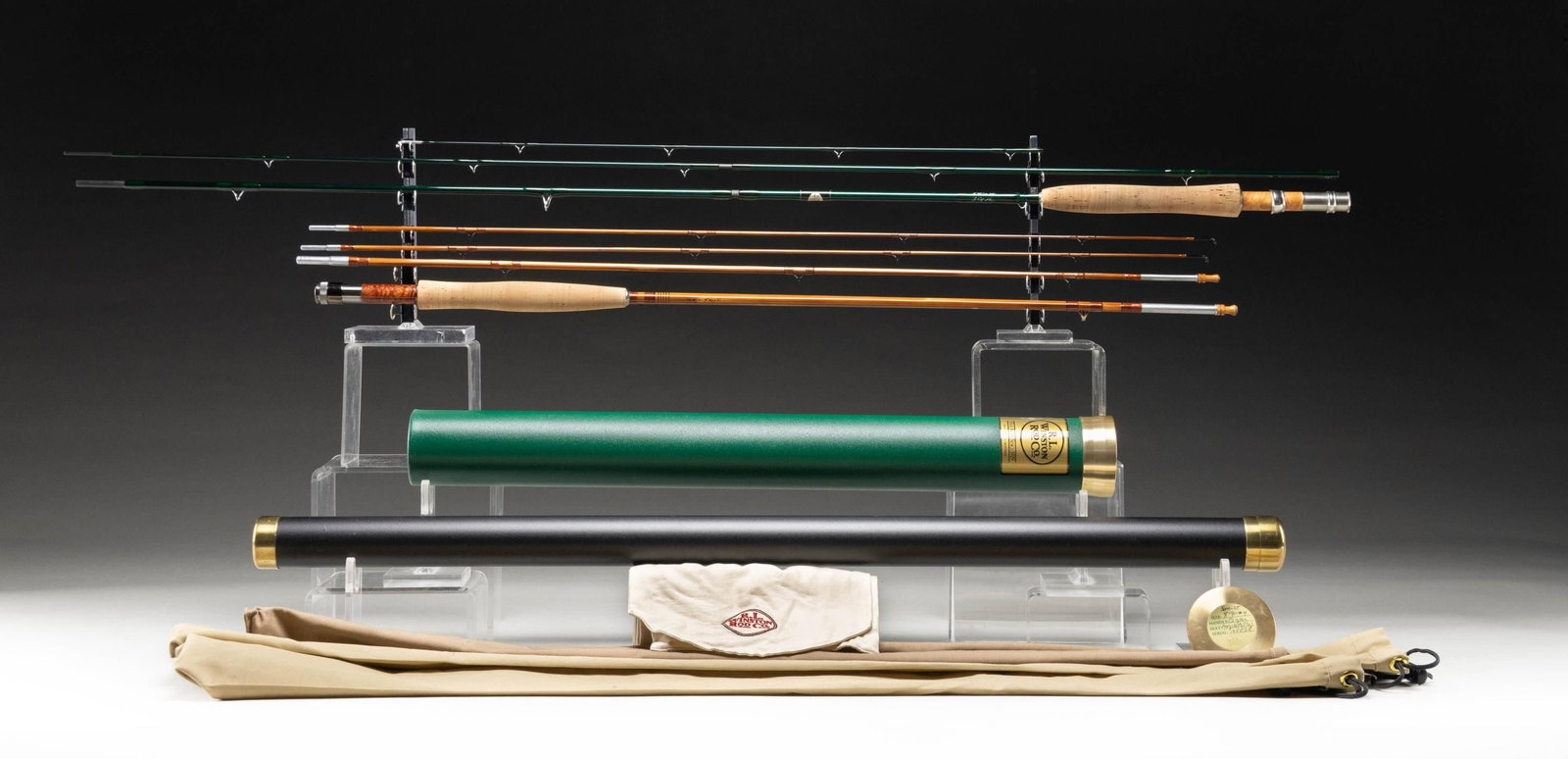 2 HIGH QUALITY TROUT FLY RODS.: 1) Copper John (Mike Pahl) bamboo fly rod. 7-1/2', 3 piece, 2 tips, 5 weight, burl reel seat, marked "7 1/2' 5 WT" "Copper John", original bag and tubes. CONDITION: very fine. Possibly unfished. 2) R.