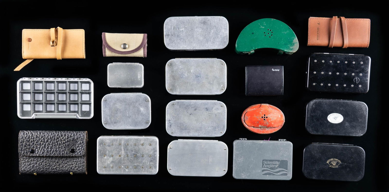 13 FLY BOXES MOST BY WHEATLEY 4 WALLETS & 2 BAIT: CANS. 1) 5 - Aluminum Wheatley boxes with spring clips: 3-6" 1- 5" 1-3-1/2" which has compartments as well. CONDITION: good to fine. 2) 2 - 6" Black anodized Wheatley boxes with foam interior each