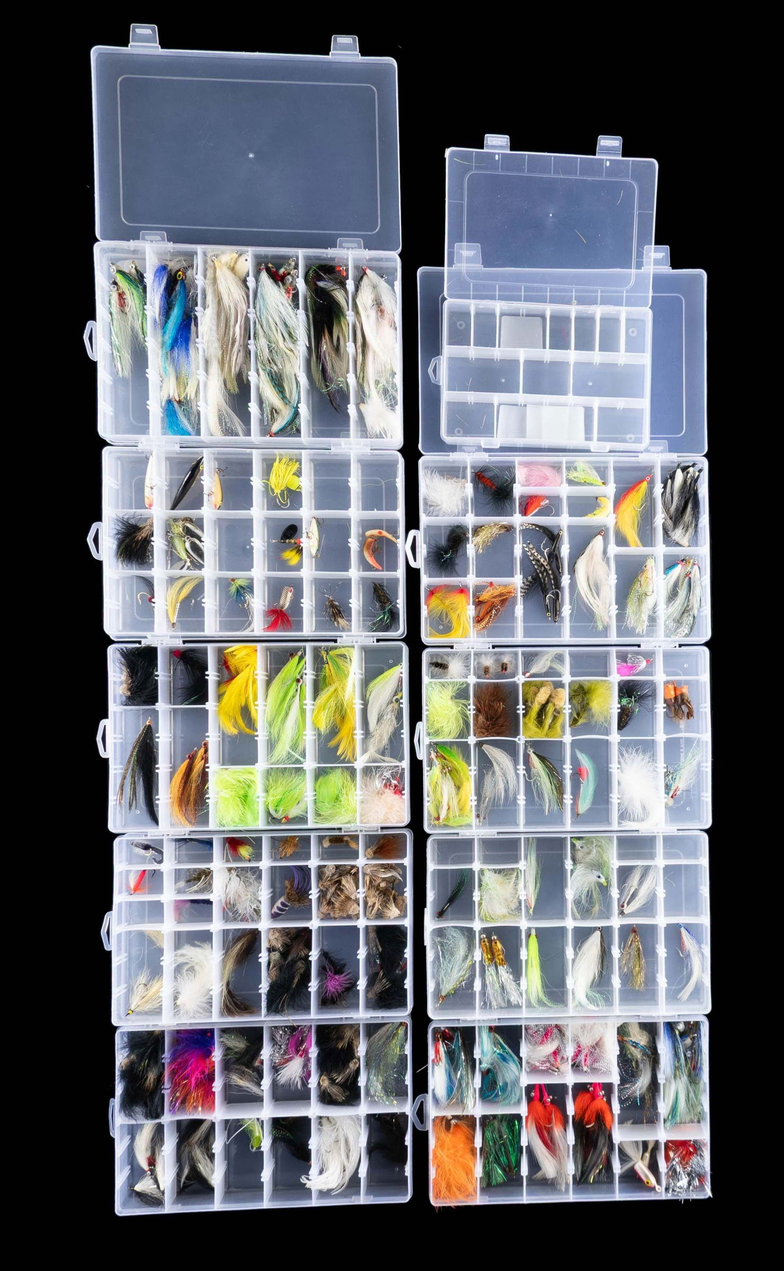 LARGE GROUPING OF FRESH & SALTWATER FLIES & LURES.: 9- 11" X 7" X 2" plastic boxes containing over 150 larger saltwater streamer flies, some "Lazy Ike" lures; along with 1 empty smaller plastic box. CONDITION: appear unfished. PROVENANCE: From the