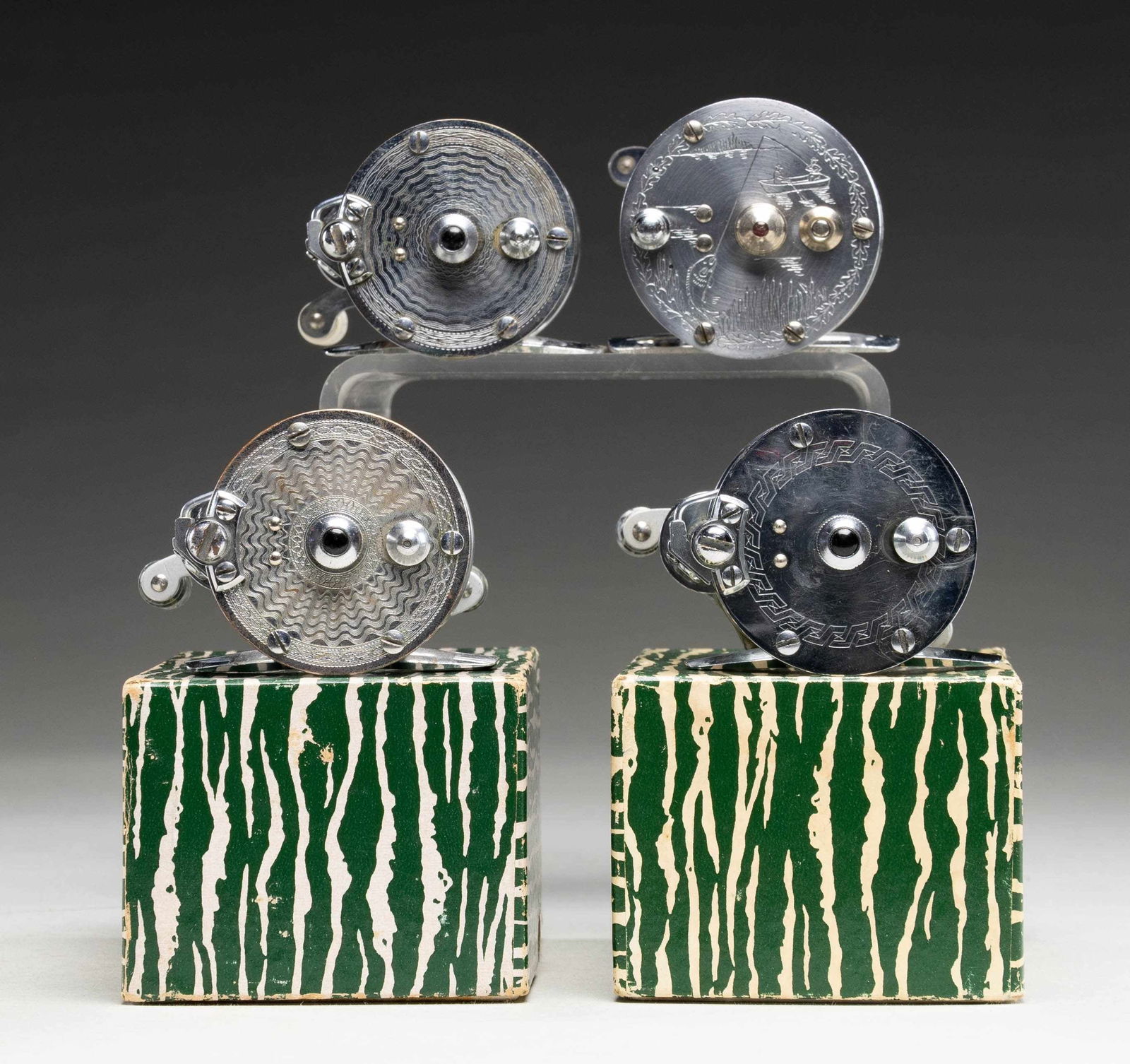 4 BAIT CASTING REELS. - 2