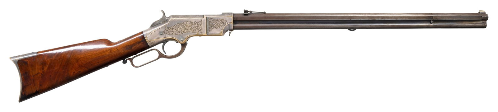 FINE DELUXE SAMUEL HOGGSON FACTORY ENGRAVED HENRY: RIFLE. Cal. 44. S# 12352. This rifle is a very attractive published silver plated Hoggson factory engraved Henry rifle, among the best of its genre. 130 Hoggson engraved Henry rifles survive in data b