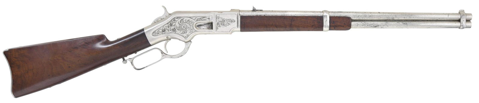 FINE ULRICH ENGRAVED WINCHESTER 1866 CARBINE.: Cal 44. S# 132675. Standard configuration, 20" barrel, 2 lines "Kings Improvement" address, two position adjustable sight, full nickel plating and distinctive Ulrich floral scroll engraving with well