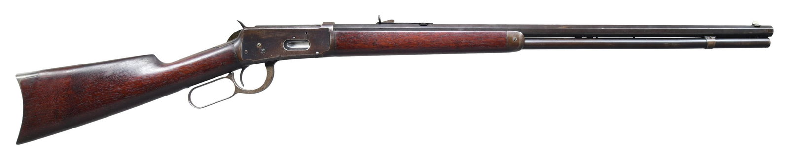SECOND YEAR OF PRODUCTION WINCHESTER MODEL 1894: LEVER ACTION RIFLE. Cal. 38-55 WCF. S# 24032. Bbl. 26". Early Winchester Model 1894 mfg. in 1895. octagonal bbl. Full length mag. tube. Blue finish. Plain wood forearm and straight grip buttstock with