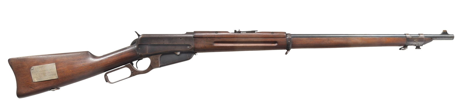 WINCHESTER 1895 MUSKET PRESENTED TO THE: ADMINISTRATOR OF THE PALOMETA QUEBRACHO COMPANY BY THE EMPLOYEES IN APRIL OF 1907. Cal. 30 Army (30-40 Krag). S# 53449. Mfg. 1906. Bbl 28" with pinned blade front sight. Military wind gauge rear sight