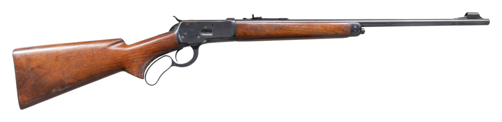 WINCHESTER 65 LEVER ACTION RIFLE.: Cal. 32 WCF. S# 1006383. Bbl. 22" with hooded stippled ramp beaded front sight. Elevator adjustable sporting rear sight. Uncheckered pistol grip walnut stock set with checkered steel shotgun buttplate