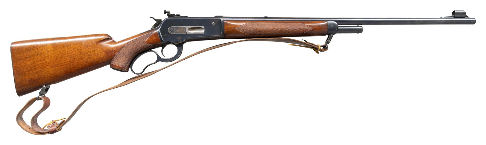 WINCHESTER MODEL 71 DELUXE LEVER ACTION RIFLE.: Cal. 348 WCF. S# 14068. Bbl. 24" rnd. Hooded ramp bead front sight, filler in rear dovetail, with bolt peep sight. Half length tubular mag. Long tang pre-war action. Blue finish. Forearm and hard rubb