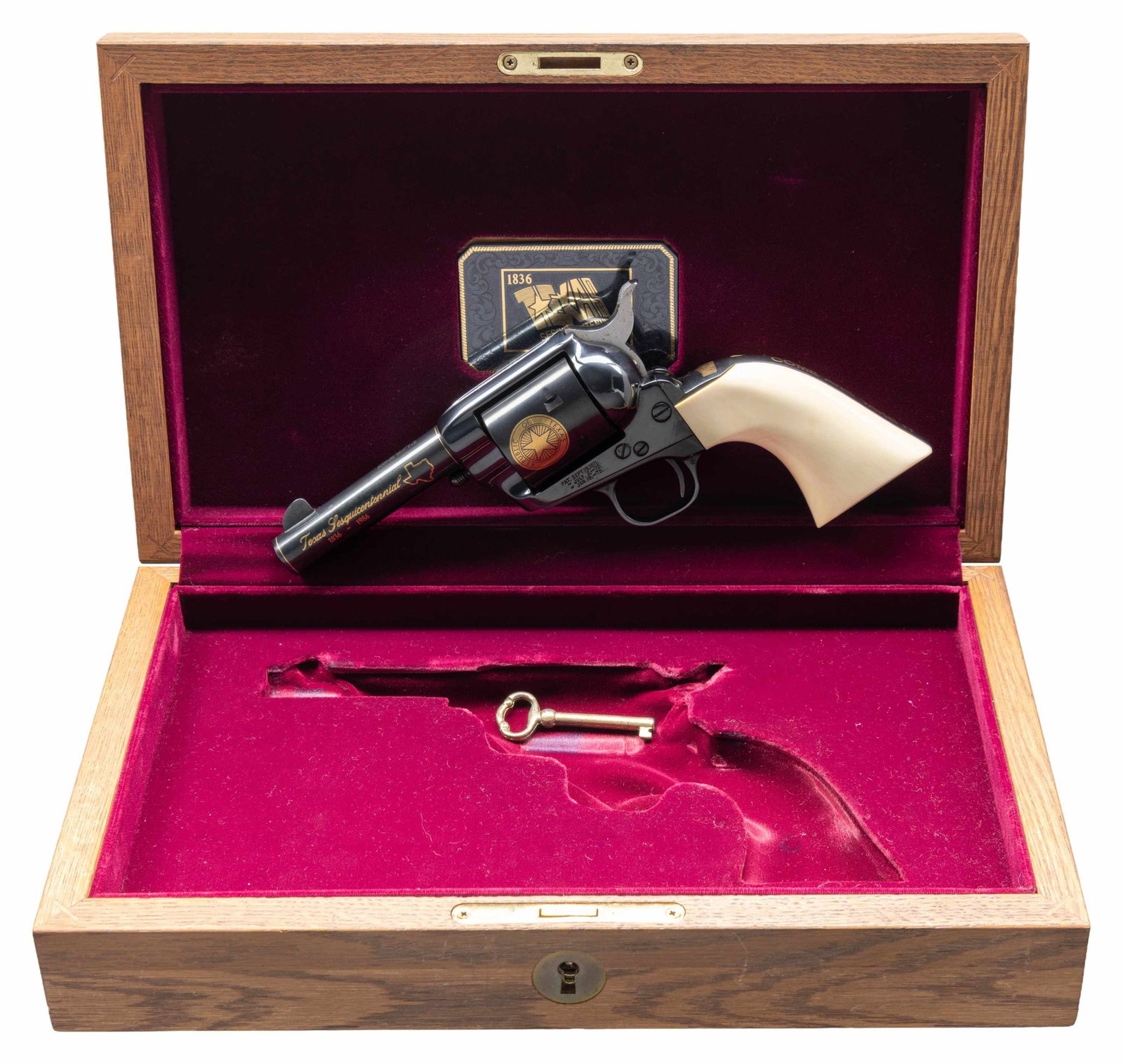 COLT SINGLE ACTION ARMY SHERIFF'S MODEL TEXAS: SESQUICENTENNIAL REVOLVER WITH DISPLAY CASE. Cal. 45. S# TX0746. Bbl. 4". Single Action Army Sheriff's Model Texas Sesquicentennial revolver mfg. by Colt in 1986. Bbl. features a single gold band at t